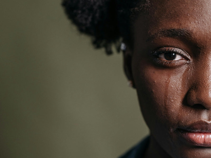 A grieving woman overcome with sadness on Mother's Day.